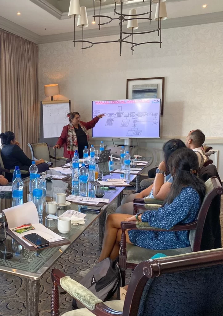 Me Mokshda Pertaub presenting during a boardroom training session
