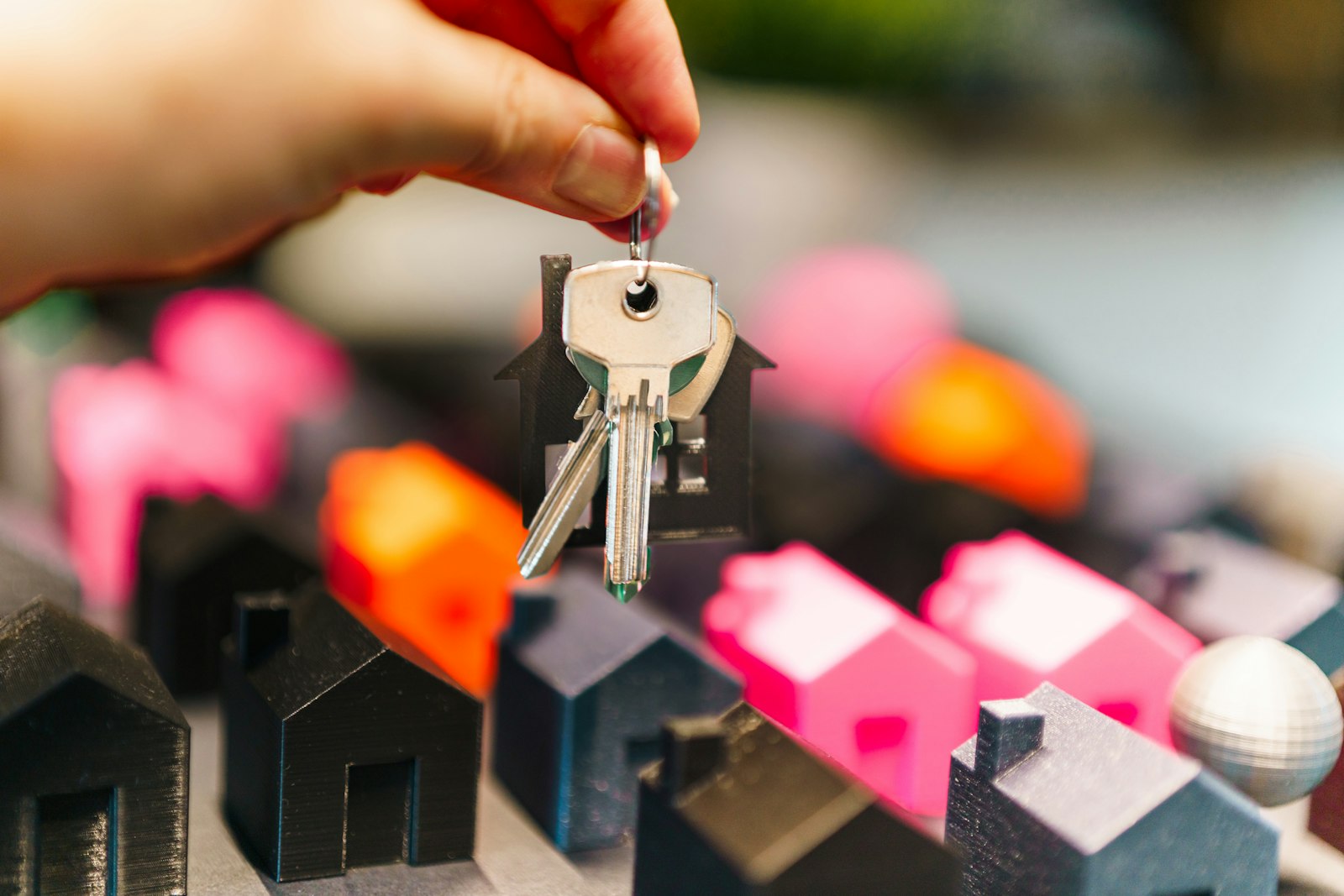 A set of house keys resting on a wooden surface